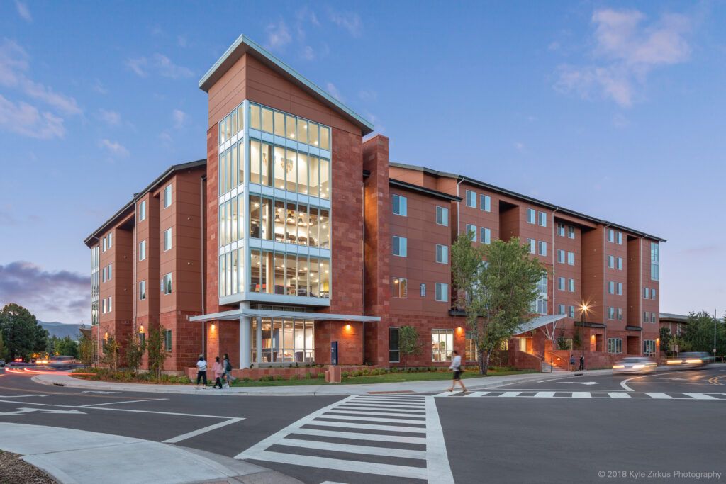 Exterior of the Honors College building at dusk. 