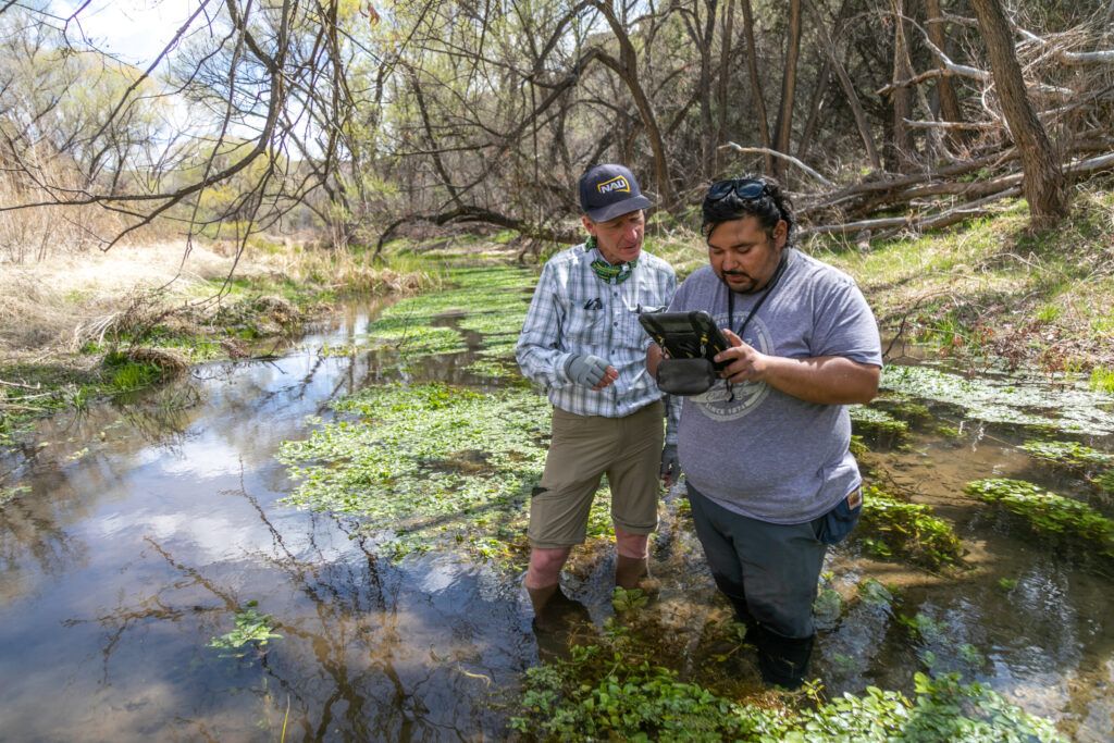 Researcher Abe Springer working with a student on a water research project.