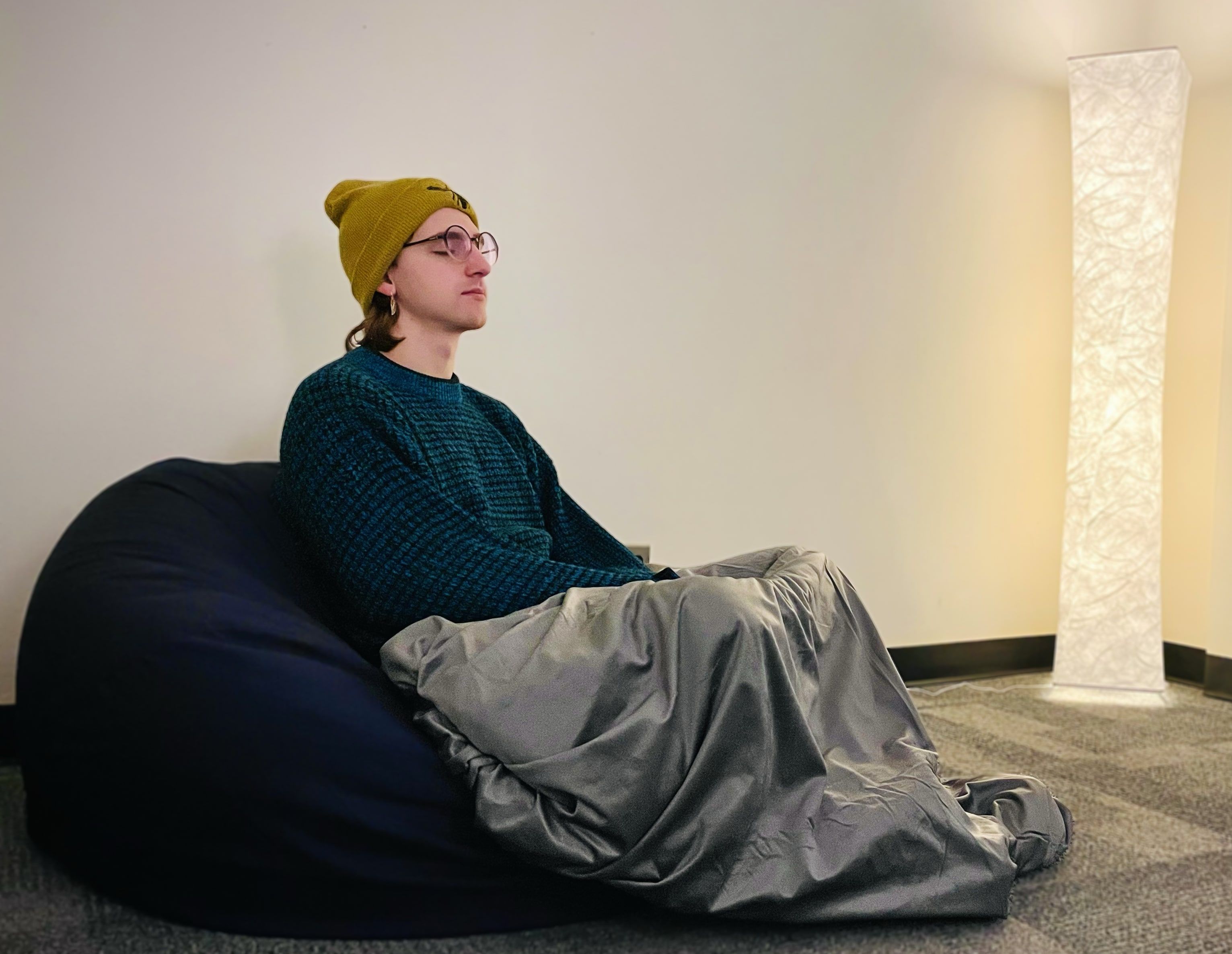 Individual sitting inside the sensory room at NAU