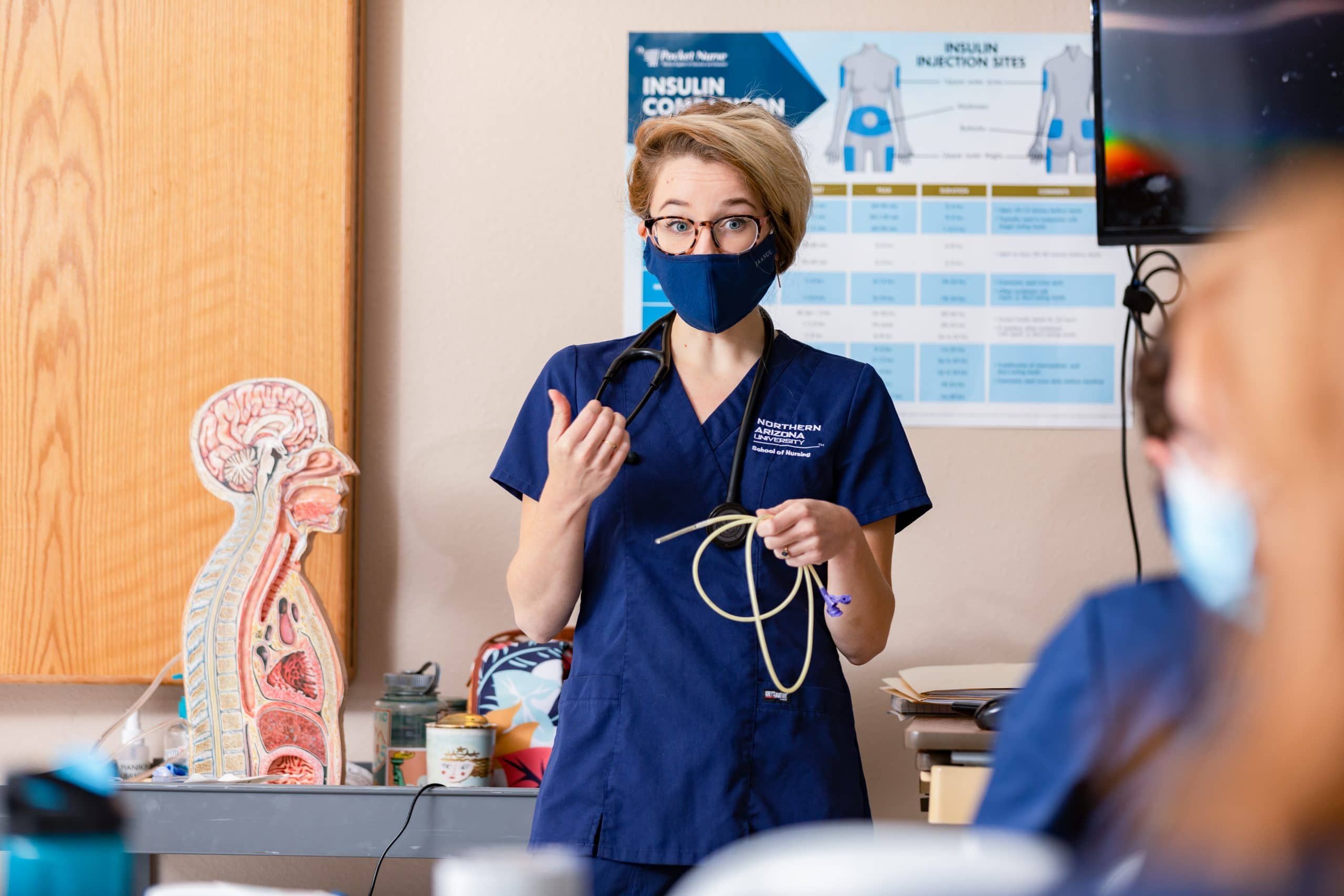 Nursing student talking to a patient.