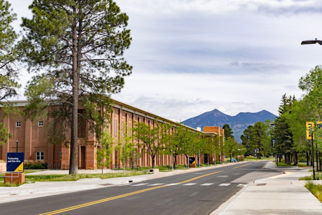 Cline Library view from Knoles Drive across from the University Union with the San Francisco Peaks in the background.